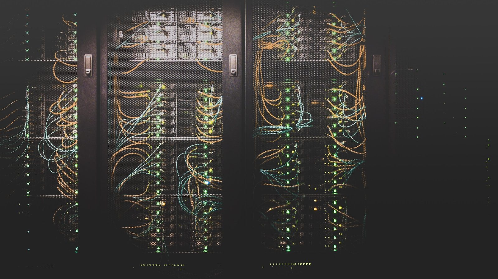 Rows of server racks with cabling
