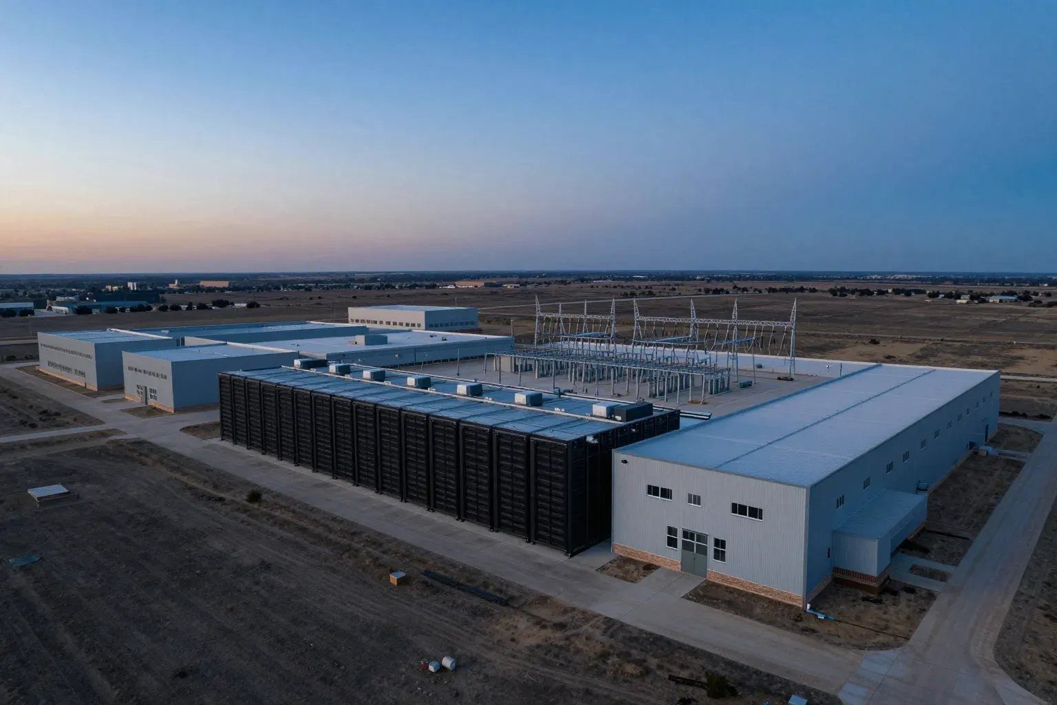 Data center campus with its own substation at dusk
